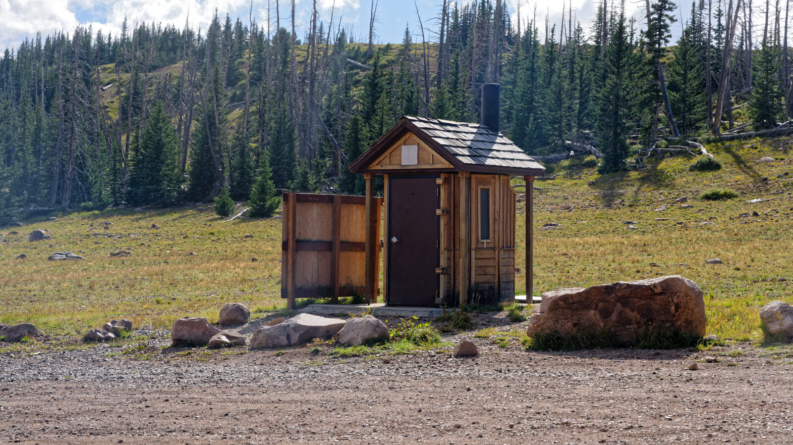 Display board with area information and a single-stall pit toilet. There is also a camp spot in the trees with some shade and privacy, room for about three rigs including trailers.