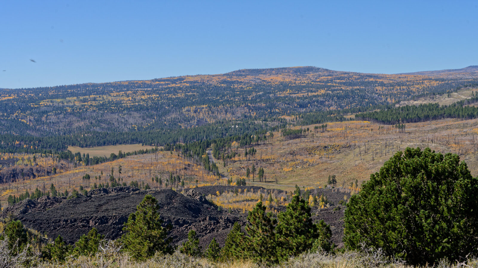 A small play area in gravelly lava rock. The rock is very loose on the hills, so take care going up and down.