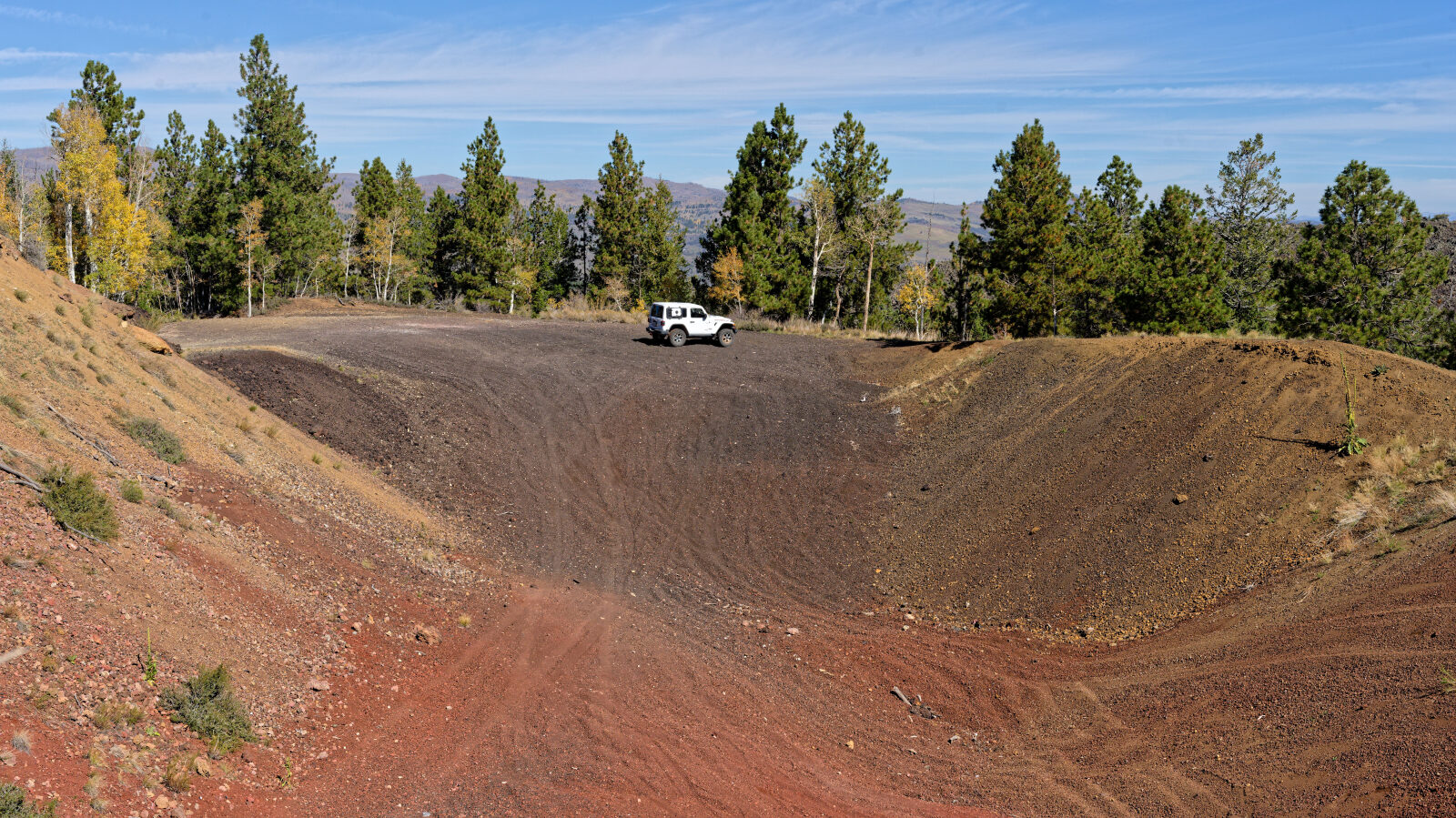A small play area in gravelly lava rock. The rock is very loose on the hills, so take care going up and down.