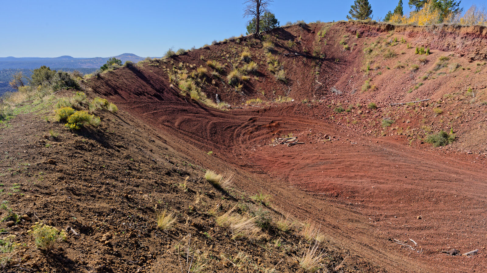 A small play area in gravelly lava rock. The rock is very loose on the hills, so take care going up and down.