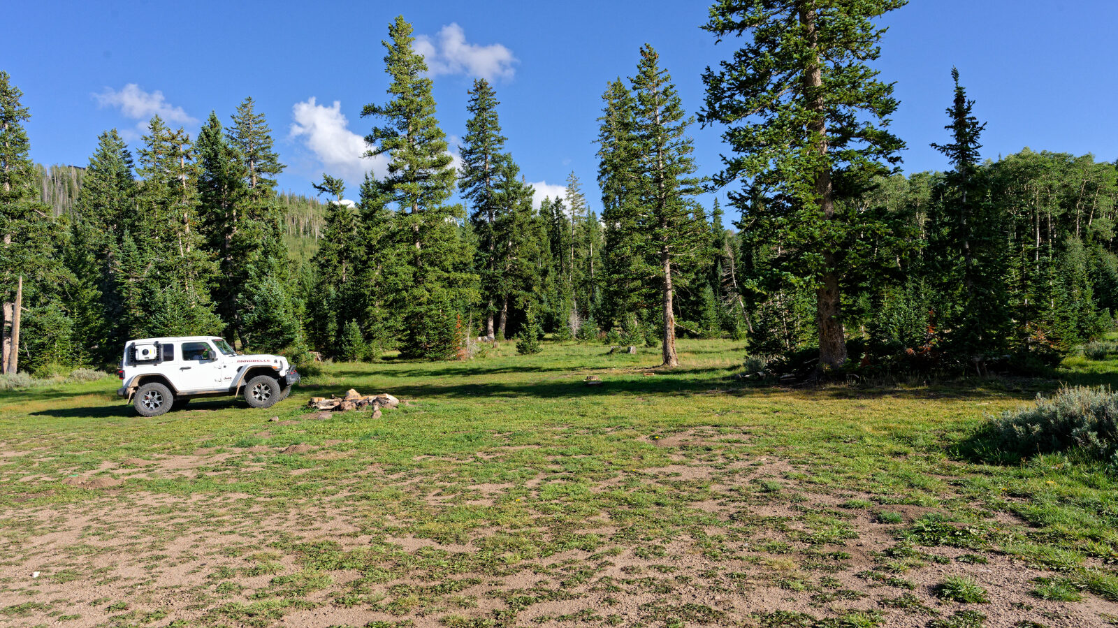 Three campsites here, maybe more, with no shade or privacy. Two can hold group campers. Pit toilets are also here.