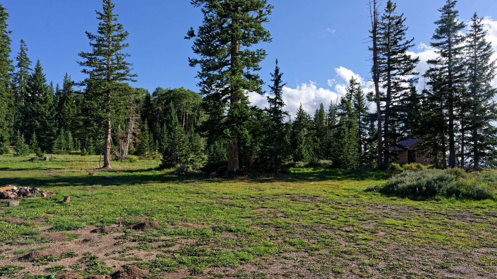 Three campsites here, maybe more, with no shade or privacy. Two can hold group campers. Pit toilets are also here.