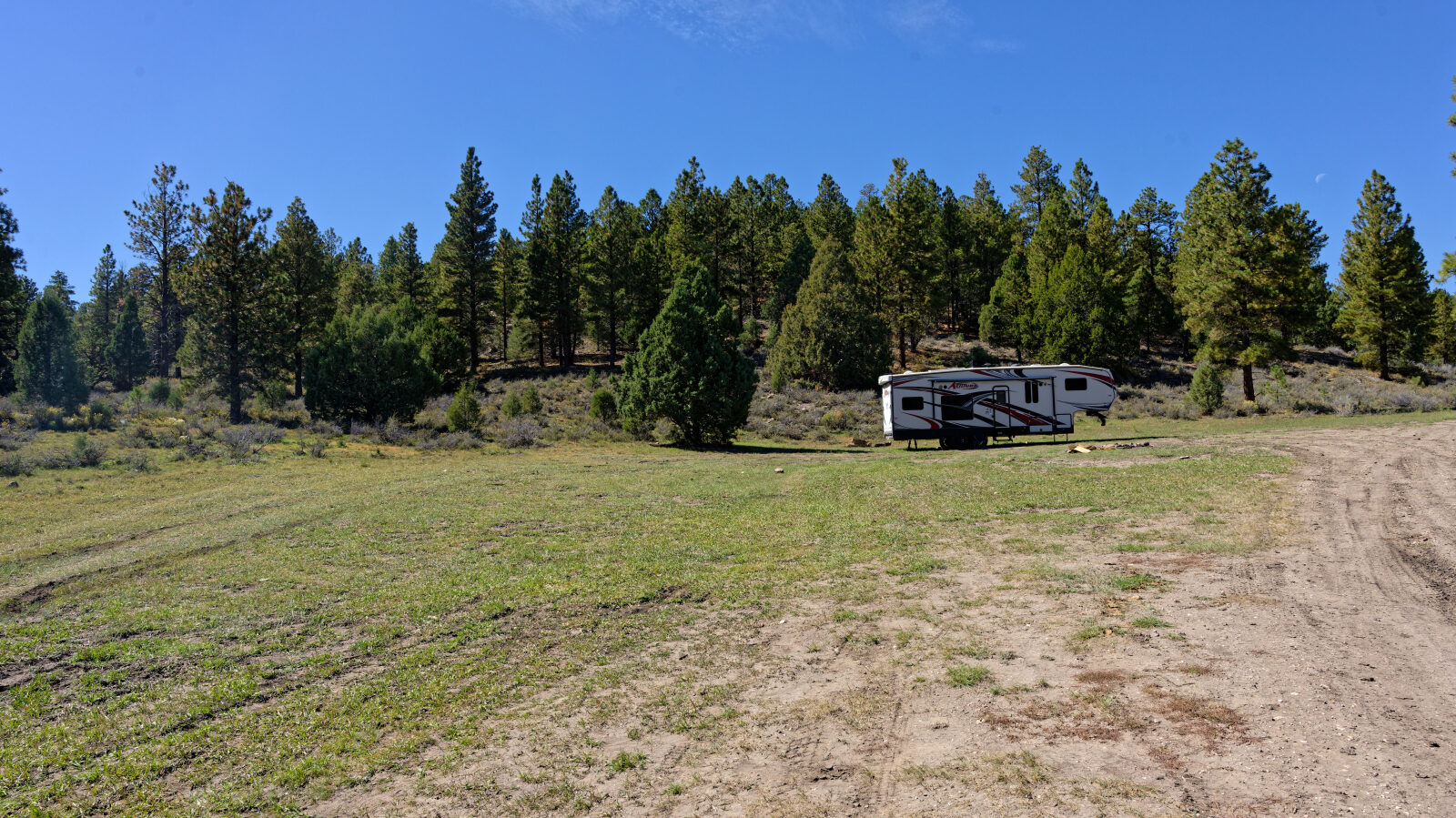 Camping with little shade and a few trees. There is some privacy if the spot is just your group.